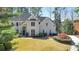 Stately two-story home with a manicured lawn and mature landscaping adding to the curb appeal at 2867 Watchtower Approach Nw, Marietta, GA 30064
