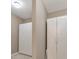 Hallway with neutral-toned walls and white wardrobe closet providing ample storage at 2867 Watchtower Approach Nw, Marietta, GA 30064