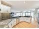 Open-concept kitchen with granite countertops, stainless steel appliances, and hardwood floors at 2867 Watchtower Approach Nw, Marietta, GA 30064