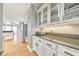 Bright kitchen features granite countertops, hardwood floors, and white cabinetry at 2867 Watchtower Approach Nw, Marietta, GA 30064