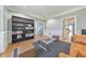 Elegant living room with hardwood floors, bookcases, and stylish glass coffee table at 2867 Watchtower Approach Nw, Marietta, GA 30064
