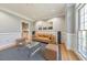 Comfortable living room featuring hardwood floors, accent wall, and ample natural light at 2867 Watchtower Approach Nw, Marietta, GA 30064