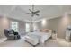 Main bedroom with a tray ceiling, carpet floors, and two windows at 2867 Watchtower Approach Nw, Marietta, GA 30064