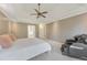 The main bedroom includes a ceiling fan, carpet floors, and views to the ensuite at 2867 Watchtower Approach Nw, Marietta, GA 30064