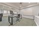 Basement office featuring a mounted monitor, a white board, and access to a living area at 2867 Watchtower Approach Nw, Marietta, GA 30064