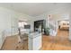 Modern office featuring hardwood floors, glass desk, and view of the staircase at 2867 Watchtower Approach Nw, Marietta, GA 30064
