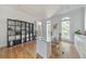 Well-lit office with hardwood floors, glass desk, built-in shelving, and large windows at 2867 Watchtower Approach Nw, Marietta, GA 30064