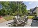 Large backyard with grass area, dining table with six chairs, and built in grill at 3034 Bristlewood Nw Ln, Marietta, GA 30064