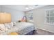 Inviting bedroom with natural light, neutral paint, carpet floors and a ceiling fan at 3034 Bristlewood Nw Ln, Marietta, GA 30064