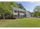Beautiful two-story home with a well-kept lawn and landscaping featuring a classic facade and attached two-car garage at 3034 Bristlewood Nw Ln, Marietta, GA 30064