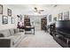 Spacious living room with plush carpeting and a modern entertainment center for relaxation and leisure at 3034 Bristlewood Nw Ln, Marietta, GA 30064