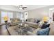 Comfortable living room showcasing hardwood floors, plush sofas, and ample space for entertaining at 3034 Bristlewood Nw Ln, Marietta, GA 30064