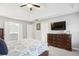 Spacious main bedroom featuring a tray ceiling, large dresser, and ensuite bathroom at 3034 Bristlewood Nw Ln, Marietta, GA 30064