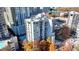 High-rise condo with balconies, rooftop pool, and surrounding mature trees with fall colors at 275 13Th Ne St # 310, Atlanta, GA 30309