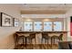 Interior shot of bar with stylish stools, lighting, and decor at 275 13Th Ne St # 310, Atlanta, GA 30309