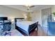 Bright bedroom featuring a modern ceiling fan, hard floors, and unique glass block wall at 275 13Th Ne St # 310, Atlanta, GA 30309