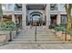 Building entrance with stairs, greenery, and a clear view of the front door at 275 13Th Ne St # 310, Atlanta, GA 30309