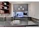 Modern kitchen with granite countertops, stainless steel appliances, and an open view of the living room and balcony at 275 13Th Ne St # 310, Atlanta, GA 30309
