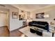 Inviting living room featuring hardwood floors, plush seating, and an open layout with a view into the kitchen at 275 13Th Ne St # 310, Atlanta, GA 30309