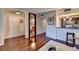 Inviting living room with hardwood floors, a stylish bookshelf, and an open view of the contemporary kitchen at 275 13Th Ne St # 310, Atlanta, GA 30309