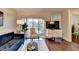 Bright living room with sliding glass doors to balcony, contemporary furniture, and sleek entertainment center at 275 13Th Ne St # 310, Atlanta, GA 30309