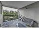 Private outdoor patio featuring seating for entertaining, plus a treed view at 275 13Th Ne St # 310, Atlanta, GA 30309