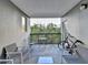 Private outdoor patio featuring seating for entertaining, plus a treed view at 275 13Th Ne St # 310, Atlanta, GA 30309