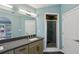 Bathroom featuring a single sink, granite countertop, and a glass-enclosed shower at 621 Spruce Dr, Stone Mountain, GA 30083