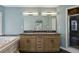 Bathroom boasts double sinks, granite countertops, a soaking tub, and a glass-enclosed shower at 621 Spruce Dr, Stone Mountain, GA 30083