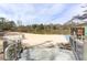 Community beach with sandy shore and lake access, featuring seating, walkway, and outdoor recreation area at 621 Spruce Dr, Stone Mountain, GA 30083