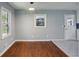 Fresh dining room featuring gleaming hardwood floors, natural light, and modern lighting at 621 Spruce Dr, Stone Mountain, GA 30083