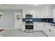 Beautiful kitchen with custom cabinets, modern appliances, and an eye-catching backsplash at 621 Spruce Dr, Stone Mountain, GA 30083
