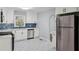 Modern kitchen featuring stainless steel appliances, custom cabinets, and eye-catching backsplash at 621 Spruce Dr, Stone Mountain, GA 30083
