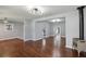 Bright living room with beautiful hardwood floors, modern light fixtures, and fresh paint at 621 Spruce Dr, Stone Mountain, GA 30083
