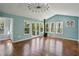 Bright living room with hardwood floors, neutral paint, and plenty of natural light at 621 Spruce Dr, Stone Mountain, GA 30083