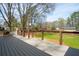 Enjoy a sprawling backyard view from the wooden deck that features a built-in outdoor grill and bar at 1199 Murray Sw Cir, Marietta, GA 30064