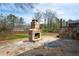 Backyard featuring stone patio with outdoor fireplace and seating area at 1199 Murray Sw Cir, Marietta, GA 30064