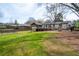 Large grassy yard with mature trees offering shade for outdoor living and recreation at 1199 Murray Sw Cir, Marietta, GA 30064