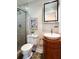 Charming bathroom featuring a vessel sink on a wooden cabinet and glass-enclosed shower at 1199 Murray Sw Cir, Marietta, GA 30064