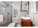 Charming bathroom featuring a vessel sink on a wooden cabinet and glass-enclosed shower at 1199 Murray Sw Cir, Marietta, GA 30064