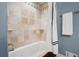Bathroom featuring a tiled bathtub with jacuzzi jets and neutral-colored walls at 1199 Murray Sw Cir, Marietta, GA 30064