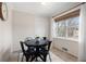 Bright breakfast nook featuring a black round table, seating for four, and a window with natural light at 1199 Murray Sw Cir, Marietta, GA 30064