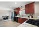 Updated kitchen featuring granite counters, modern appliances, and adjoining dining area at 1199 Murray Sw Cir, Marietta, GA 30064