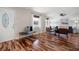 Bright living room showcasing hardwood floors, neutral paint, and a decorative front door at 1199 Murray Sw Cir, Marietta, GA 30064
