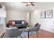Comfortable living room with a gray sofa, two chairs, hardwood floors, and a neutral color palette at 1199 Murray Sw Cir, Marietta, GA 30064