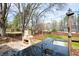 Flagstone patio with stone fireplace and granite outdoor kitchen for the ultimate backyard experience at 1199 Murray Sw Cir, Marietta, GA 30064