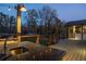 Outdoor kitchen with sink, deck, and wooden railing, perfect for entertaining at 1199 Murray Sw Cir, Marietta, GA 30064