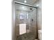 Shower featuring decorative tile accents and a glass door with modern fixtures and finishes at 1199 Murray Sw Cir, Marietta, GA 30064