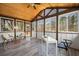 Charming sunroom with wood-paneled ceiling, large windows, and stylish decor at 1199 Murray Sw Cir, Marietta, GA 30064