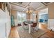 Well-lit dining room featuring stylish decor, hardwood floors, and a comfortable dining set at 1249 Austin Thomas Dr, Dacula, GA 30019